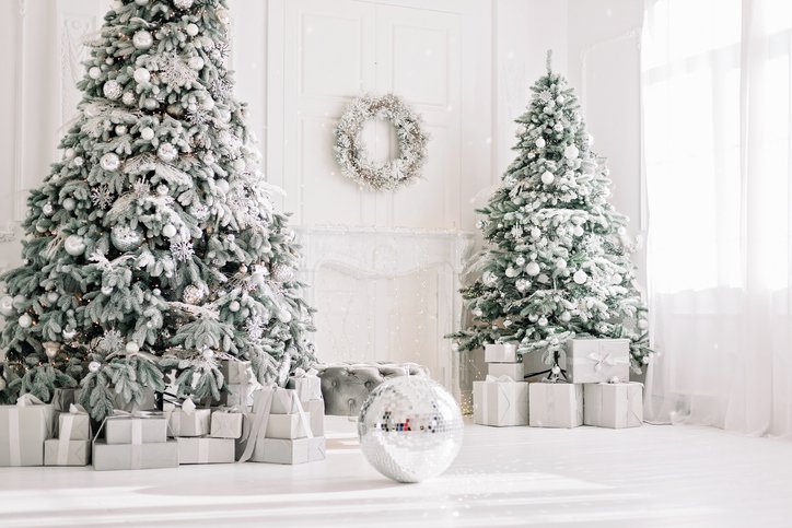 Festive interior. Luxurious Christmas tree decorated with lights with gifts. Happy New Year 2021. Christmas concept. Soft selective focus. Copy space.