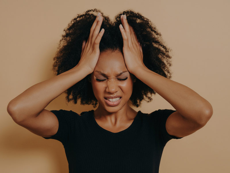 a woman with a headache