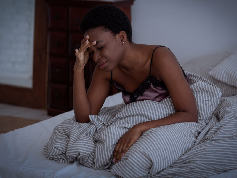 a woman in bed who is having trouble sleeping