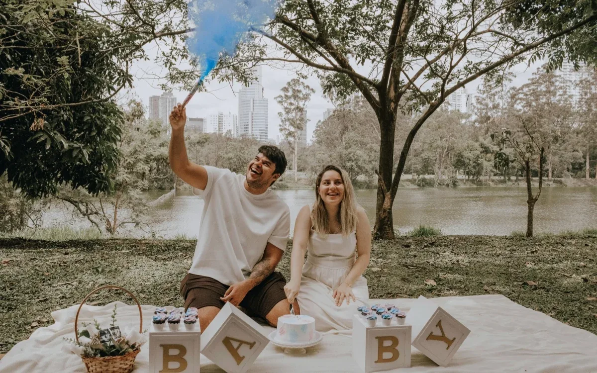 Pregnant woman holding her belly, representing early pregnancy blood test for gender reveal